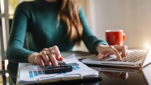 A business owner managing monthly bookkeeping work