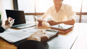 Estate and trust advisor meets with client about taxes