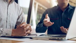 Coworkers discuss new business tax provisions