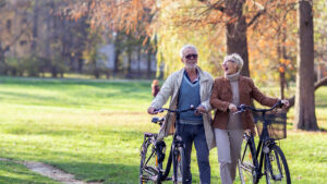 Couple walking with their bikes