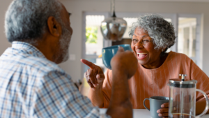 Elderly couple drinking coffee