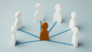 White figures connected to a central orange figure