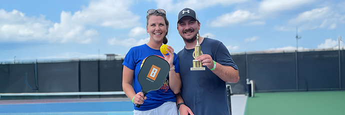 2025 Pickleball Champions posing with their trophy.