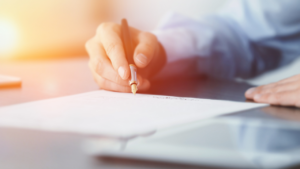 A CFO signing a 401k fees document.