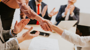 Accountants finalizing a deal.