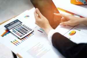 An outsourced accountant looking at a financial forecast.